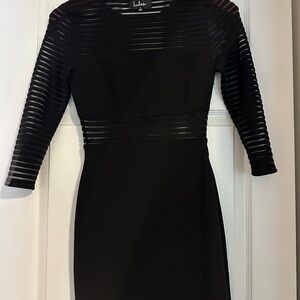 Black formal dress, see through detail on arms, top of chest, and waist belt